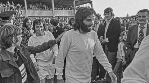 George Best walks out to play for Dunstable Town