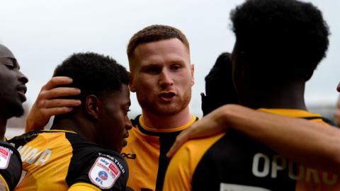 Newport County players celebrate scoring against Gillingham 