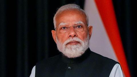 India's Prime Minister Narendra Modi - wearing a black sleeveless jacket over a white kurta - looks on during a meeting with Iceland's Prime Minister at the Radisson Blu Plaza Hotel in Oslo, Norway, on 19 May.