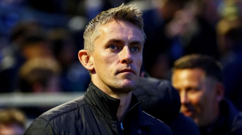 Kieran McKenna looks on from the sidelines at Fratton Park