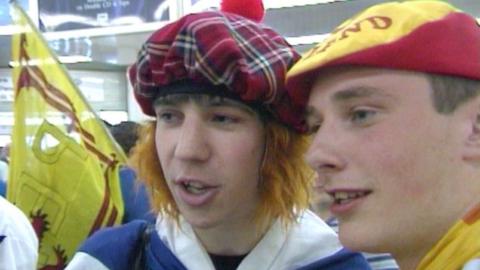 Two scotland fans wearing hats