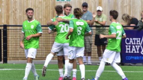 Guernsey FC celebrate Will Fazakerley's stoppage-time goal