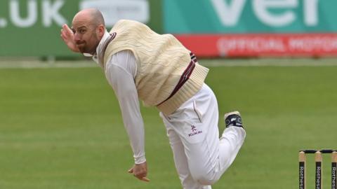 Former England spinner Jack Leach bowling for Somerset