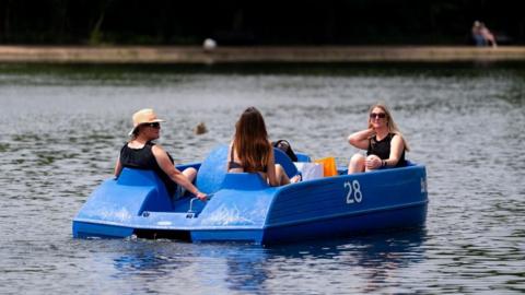 Three woman in a pedal boat in Hyde Park