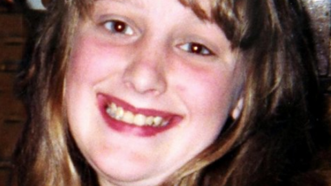 Charlene Downes, with long brown hair, smiles for the camera in a photo released by her family.