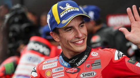 Marc Marquez waves to the crowd after his race win