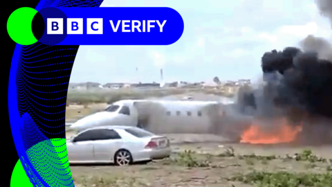 Screengrab from video showing DR Congo aircraft off the runway and on fire