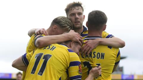 Torquay players celebrate Brad Ash's goal