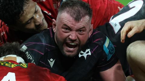 Sam Parry celebrates scoring against Scarlets