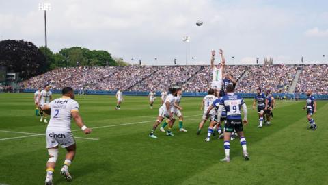 Players at the Recreation Ground backed by the club's East Stand