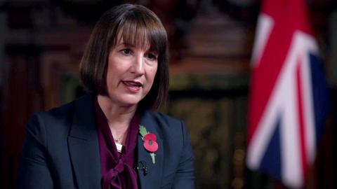 Rachel Reeves, wearing a red Remembrance poppy, speaking to BBC political editor Chris Mason after her Budget statement