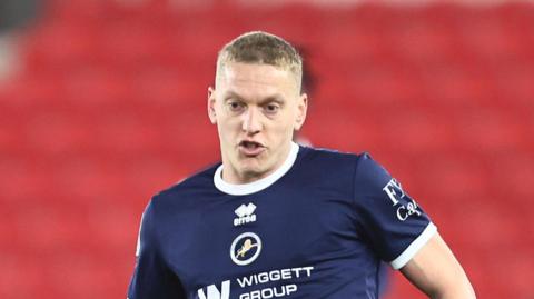 Millwall's Casper De Norre in action passing the ball
