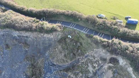 An aerial picture of the B3191 near Watchet, showing the road near the edge of the eroding cliff