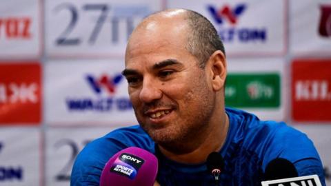 New Hampshire coach Russell Domingo speaks at a press conference 