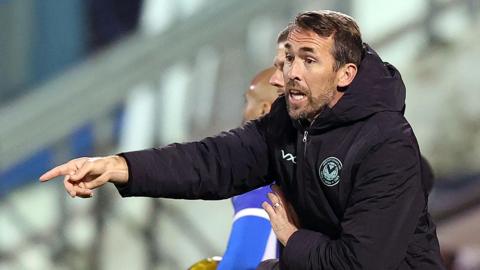 Christian Fuchs shouts instructions to Newport's players