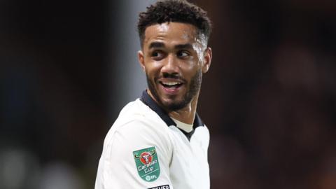 George Hall looks over his shoulder as play restarts during a match for Port Vale.