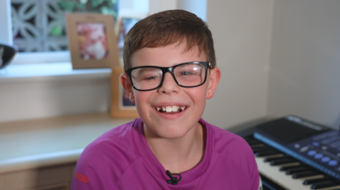Frazer smiling. 