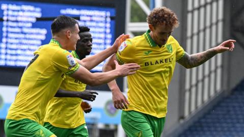 Norwich City striker Josh Sargent (right) celebrates his goal at Blackburn Rovers with teammates.
