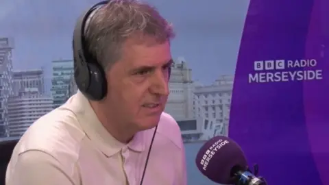 Steve Rotheram in a BBC Radio Merseyside studio
