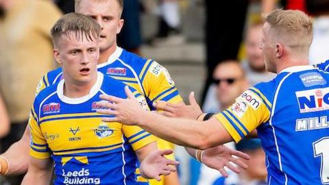 Leeds Rhinos winger Alfie Edgell is congratulated by team-mate Lachie Miller after scoring a try against Salford Red Devils.