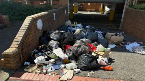 Litter and rubbing on the floor outside Priestgate House