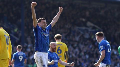 Portsmouth's Regan Poole with arms out stretched in celebration