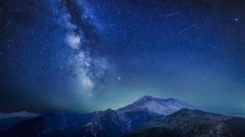 The Delta Aquariids meteor shower and Milky Way over Mount St. Helens, at Windy Ridge in Washington State.
