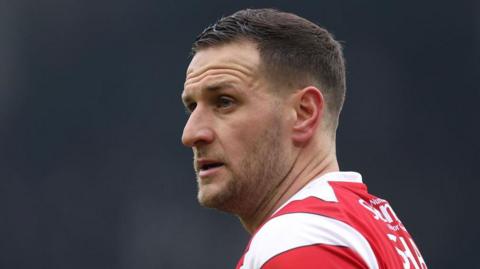 Billy Sharp looks into the distance wearing Doncaster Rovers kit