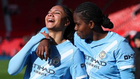 Jade Rose and Khadija Shaw celebrating after their victory over Manchester United