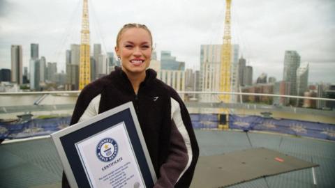 Fury holding world record certificate