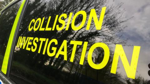 Photo of the window of a collision investigation police car