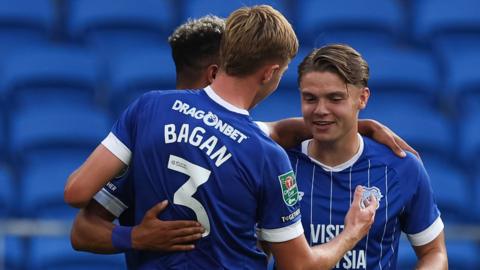 Cian Ashford (R) is congratulated on goal by Cardiff team-mates