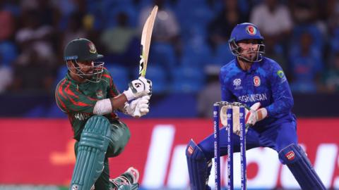 Bangladesh's Litton Das hits out, watched by Afghanistan wicketkeeper Mohammad Ishaq, at the T20 World Cup earlier in 2024