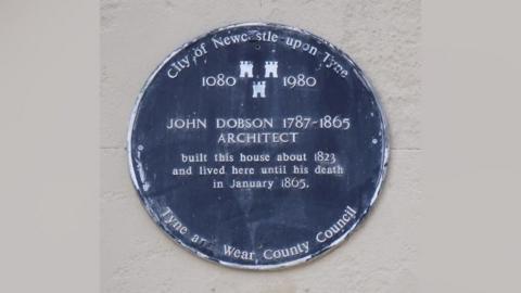 Blue plaque saying John Dobson 1787 - 1865 Architect. It also says he built this house about 1823 and lived here until his death in January 1865