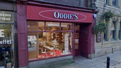 Street view of the shop front of an Oddies bakery in Colne