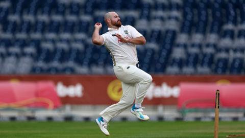 Ben Raine of Durham bowling