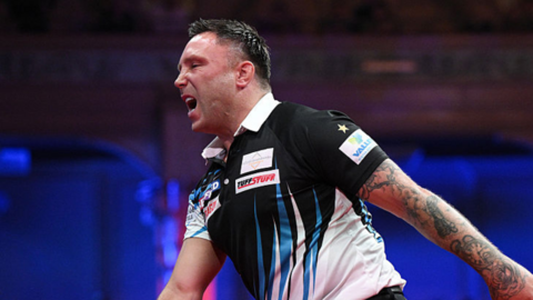 Gerwyn Price reacts on the stage in the World Matchplay final