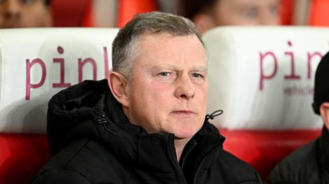 Mark Robins in the Stoke dugout