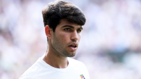 Carlos Alcaraz looks on during the Wimbledon final in 2025