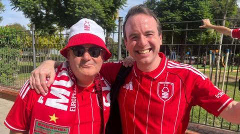Comedian Matt Forde posing for a photo with a fellow Forest fan in Seville. 