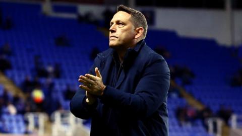 Leam Richardson applauds the Reading fans after a game