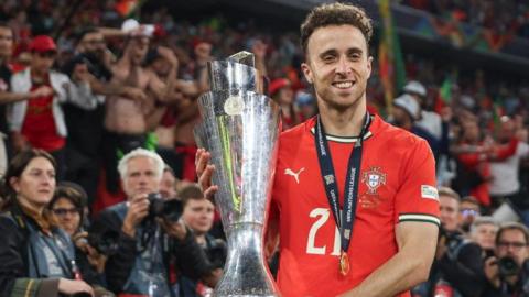 Diogo Jota with the Nations League trophy after helping Portugal defeat Spain in the final in June 2025