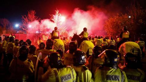 Police officers during clashes at the Aston Villa and Legia Warsaw game