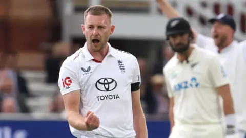 England bowler Gus Atkinson celebrates taking a wicket
