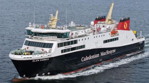 A black and white ship with red funnels