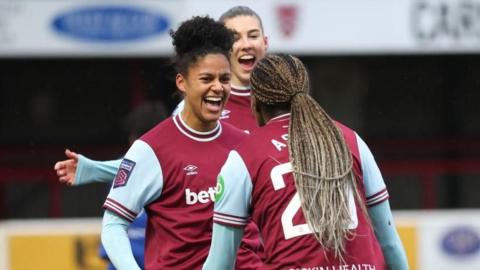 Shekiera Martinez celebrates her goal with Viviane Asseyi