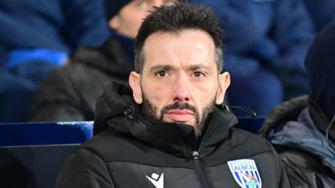 Carlos Corberan in the dugout during a match