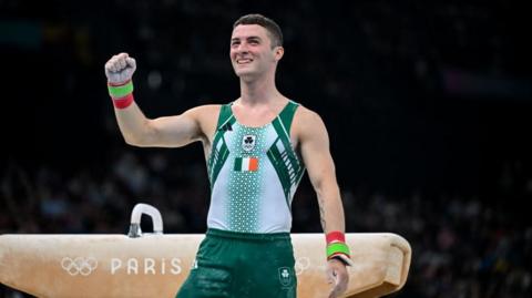 Paris , France - 27 July 2024; Rhys McClenaghan of Team Ireland punches the air before the men's pommel horse qualification at the Gymnastics Bercy Arena during the 2024 Paris Summer Olympic Games in Paris, France