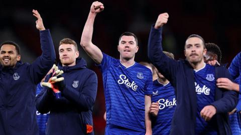 Michael Keane of Everton celebrates with the fans alongside his team-mates