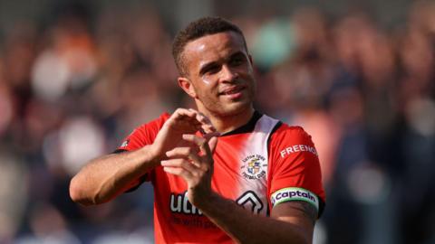 Carlton Morris of Luton Town applauds after the Premier League match between Luton Town and AFC Bournemouth 